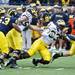 Defensive End Taco Charlton tackles quarterback Alex Swieca during the Michigan spring football game on Saturday, April 13. AnnArbor.com I Daniel Brenner